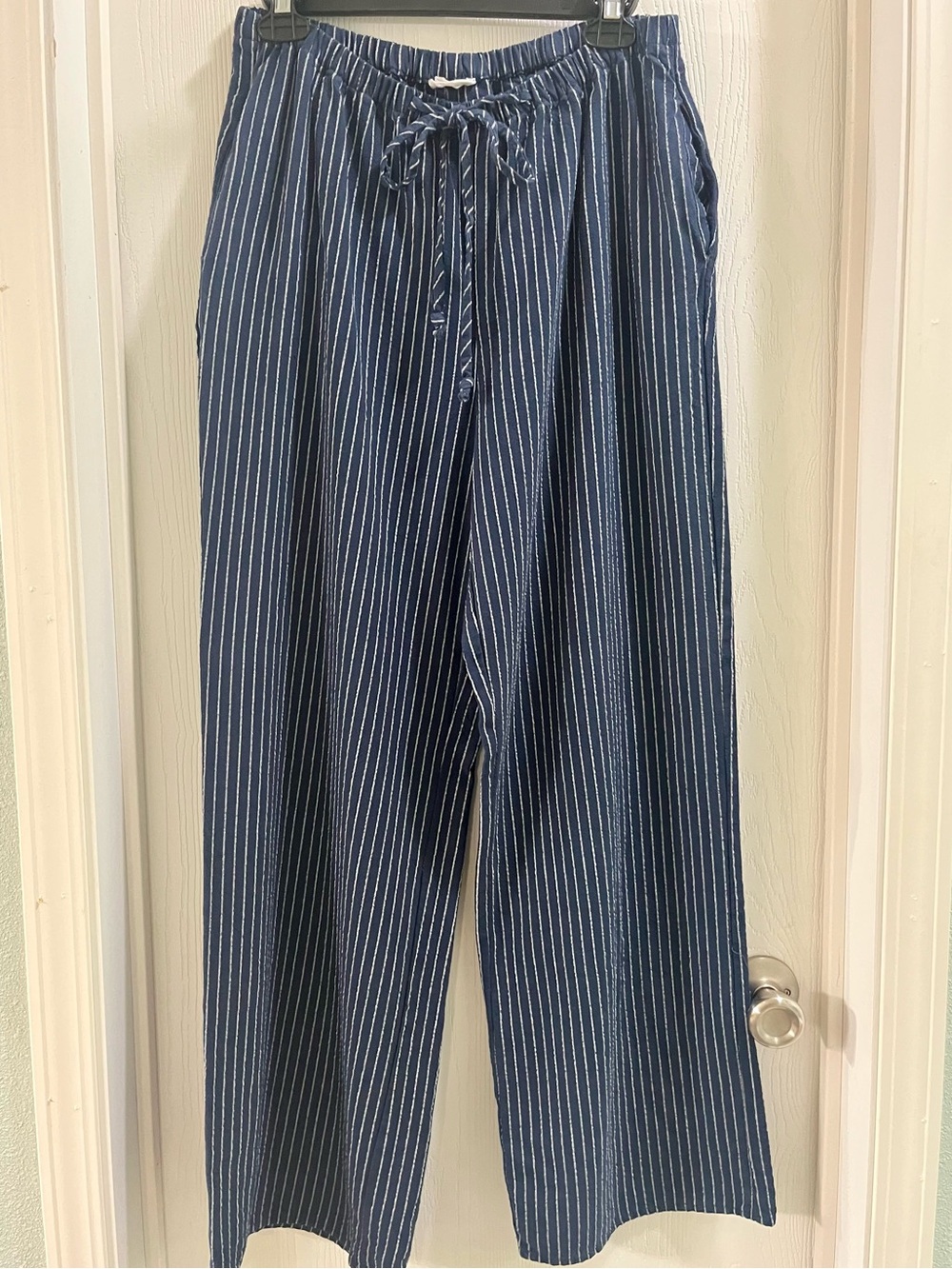 Navy blue and white pinstriped pants